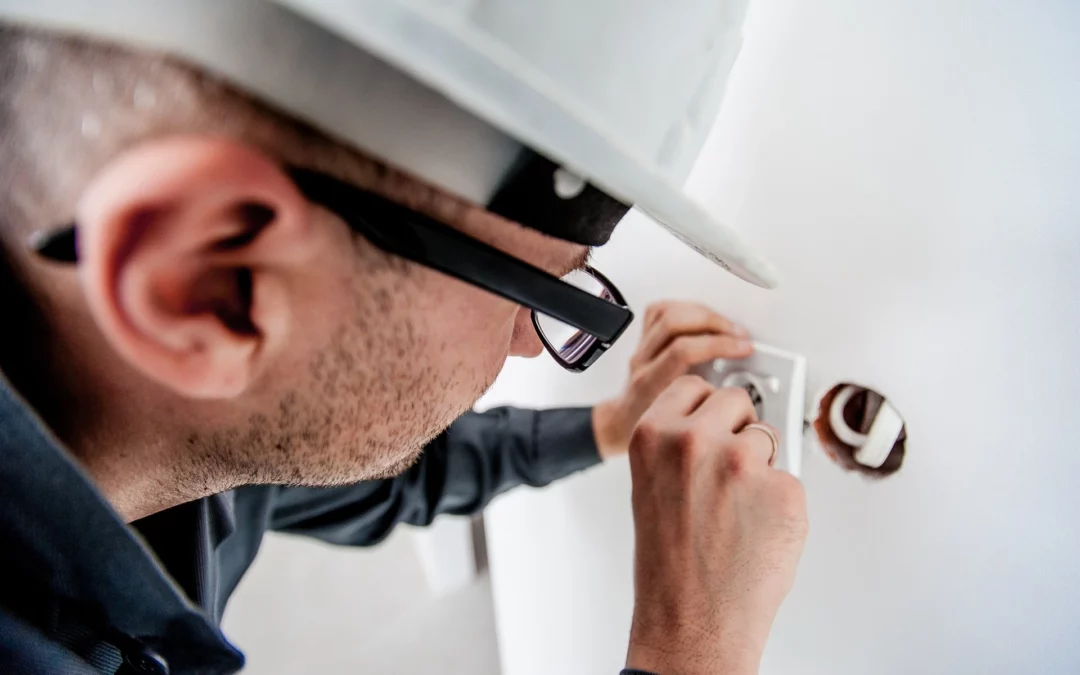 Electrician repairing home security system